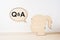 wooden girl silhouette head with word Q