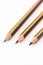 Wooden graphite pencils above white background with copy space
