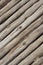 Wooden gray logs background wall slanted boards old weathered rustic pattern design