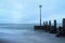 Wooden groyne on the beach