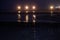 Wooden groynes and light - night photograph