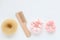 Wooden Hairbrush, barrette and Pink Scrunchy isolated on white. Flat lay Hairdressing tools and accessoriesas Color Hair