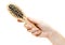 Wooden hairbrush in hand