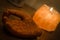 Wooden Hand with Henna Engravings and a Himalayan Rock Salt Candle