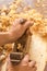 Wooden hand plane. Closeup of woodworker`s hands shaving with a plane in a joinery workshop