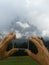 Wooden hands and a cloudy Sasslong mountain