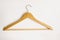 Wooden hanger hangers with metal hook on white background. Home comfort.Black Friday sale. Fashion and style