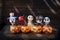 Wooden happy ghost gang with halloween pumpkin