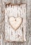 Wooden heart with birch bark on the old wood