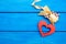 Wooden heart with a bow on a blue background, Valentine`s Day. concept of love. view from above.