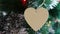 A wooden heart on the christmas tree