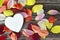 Wooden heart with copy space and dahlia flower petals