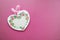 Wooden heart decorated in decoupage technique Provencal style on a pink background
