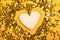 Wooden heart in golden stars on yellow background.Valentine Day 14 february, world heart day 29 september
