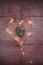 Wooden heart and heart form Christmas lights on rustic background