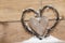 Wooden heart with perls in snow