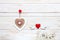 Wooden heart on rope, letters Love and figurines of pigeons with hearts. Concept for Valentine`s Day, wedding, engagement and