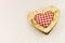 Wooden heart with squared textile in the middle