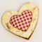 Wooden heart, squared textile in the middle