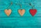 Wooden hearts on a blue background. Pendants made of wood in the form of heart. Top view