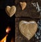 Wooden hearts floating against the fireplace