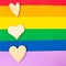 Wooden hearts on LGBTQ colors flag