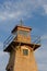 The wooden historic and automated lighthouse at the edge of the