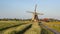 Wooden historic windmill with cycling track