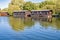 Wooden holiday chalets on the riverbank