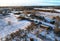 Wooden home in village in winter season. Country houses in countryside in snow.