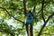 Wooden homemade birdhouse hanging on a tree