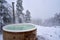 Wooden hot tub near a winter forest on a snowy day, Kroderen, Norway