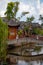 Wooden houes in Chinese style, picturesque bridge across the river in China