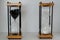 Wooden hourglasses with black and white sand representing yin and yang