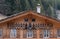 Wooden house decorated with cow bells in the Lauterbrunnen Valley, above the village of Wengen in the Swiss Alps.