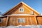 A wooden house decorated with national Russian wood carvings.