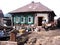 Wooden house dirty unkempt brothel with garbage and mud Russian village in Siberia