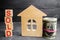 Wooden house and dollars with the inscription `sold`. sale of property, home, real estate. affordable housing.