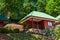 Wooden house with green tiled roof