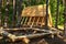 Wooden house, hut in the forest for tourists, fishermen and hunters for rest and cooking