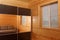 Wooden house interior - sliding-door wardrobe with a mirror