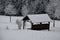 Wooden house like, shed, pergola, gazebo for tourists in the winter landscape in the mountains with a gabled roof. trees and fores