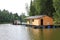 A wooden house near the water. Summer. Relax on the river. Bathhouse. Istra