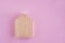 Wooden house on a pink background. The concept of peace, real estate purchase.