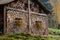 wooden house with a roof and windows made of planks