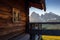 Wooden house on the Seiser Alm Alpine meadow with Langkofel group in Italy