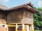 Wooden house with shut shutters on posts in Thailand. Wood house in thai