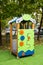 Wooden house-veranda of bright green and blue color with a pattern of gears on a clear sunny day. Playgrounds, sports, health