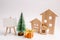 Wooden houses, Christmas tree and gifts. Christmas sale of real estate. New Year discounts for buying house. Purchase apartments