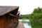 Wooden houses floating on river or lake for tourist take rest and chill out among beauty of nature with green tree background